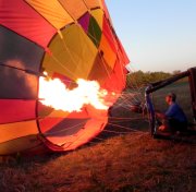 The pilot applies heat to the inside of the balloon.