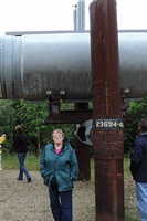 Pam under the Alaska pipeline. 