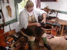 The Colonial Williamsberg shoemaker making shoes of the mid 1700's period useing the tools used then.