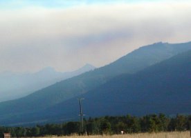 Smoke streaming into the valley from forest fires more than 100 miles west, in Idaho.
