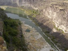 The Snake River flows far below in the canyon.