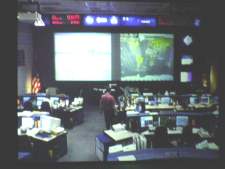 This picture was taken of a TV monitor that shows the current mission control center as it is in use for the countdown for 